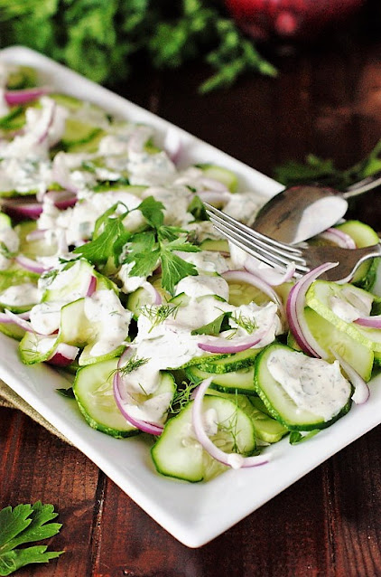 Platter of Creamy Cucumber Salad with Fresh Herbs Image
