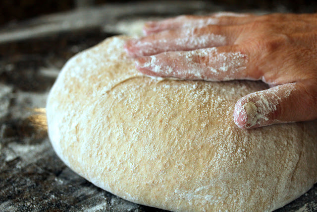Bread dough with hand