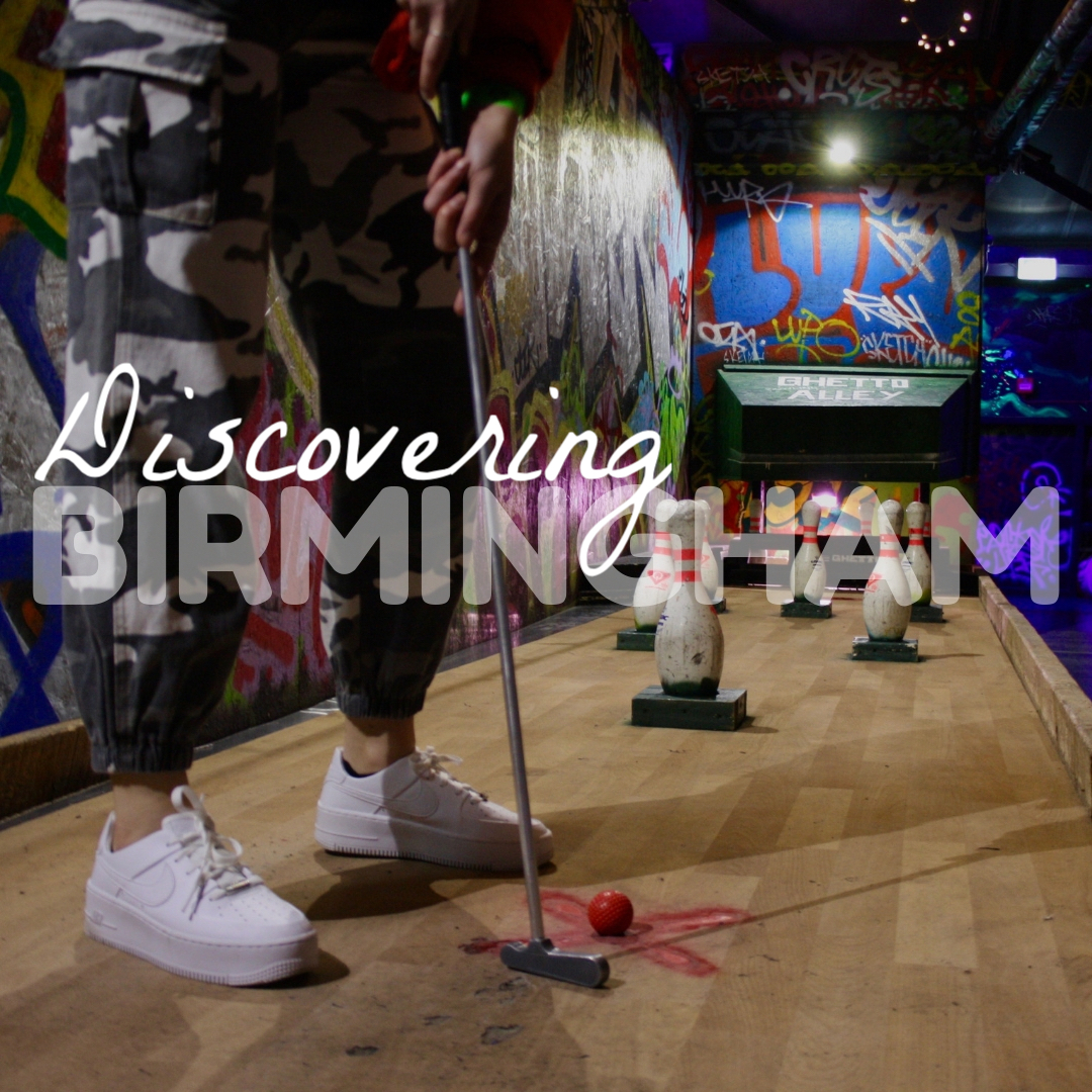 close up of playing mini golf at ghetto golf Birmingham on a bowling alley themed hole