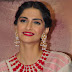 Indian Actress Sonam Kapoor Smiling Face In White Dress