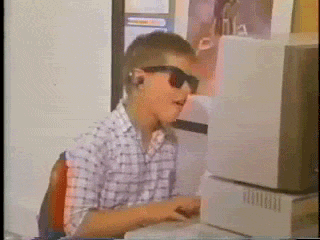 sunglasses kid sitting at PC