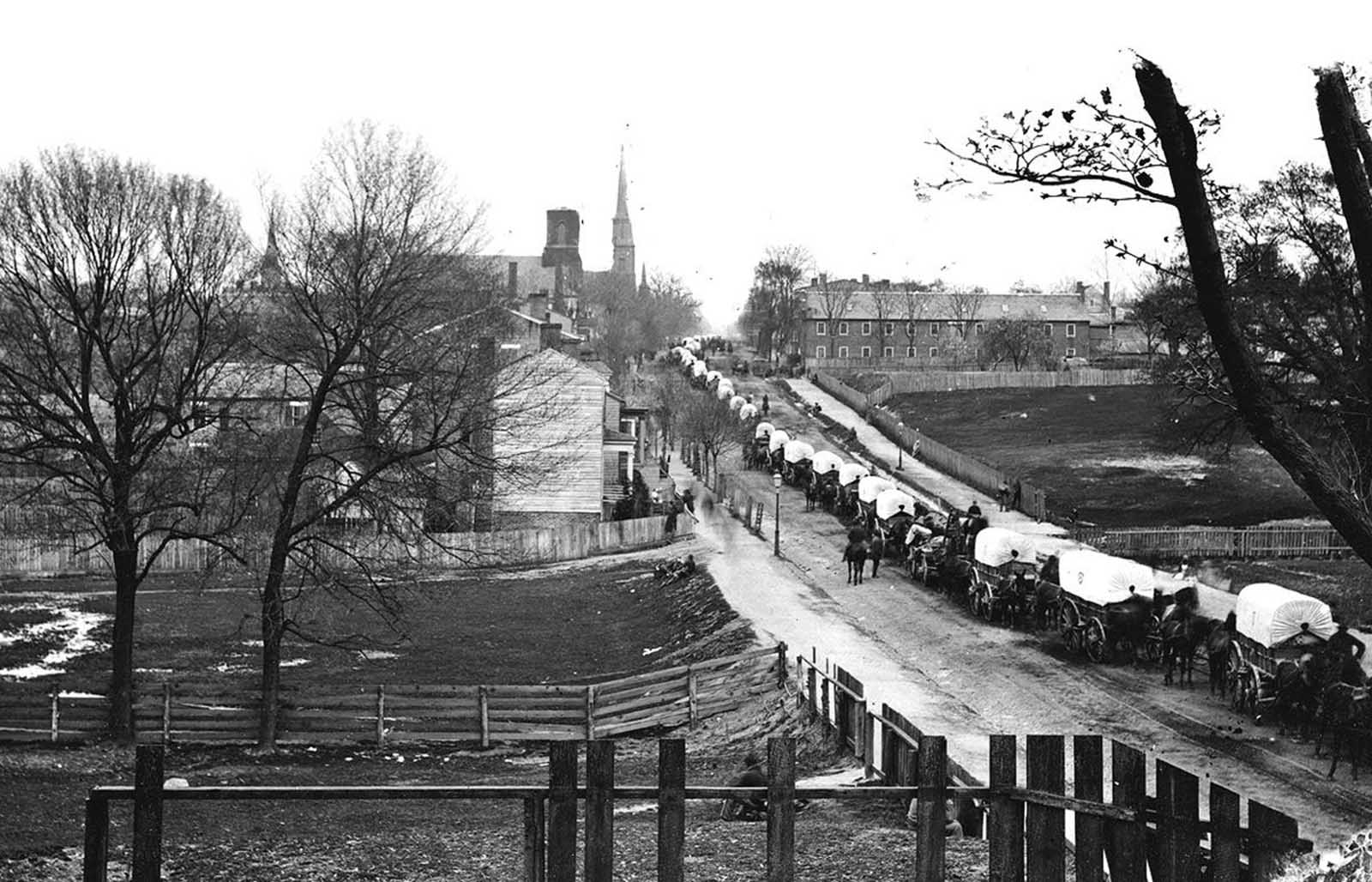 Petersburg, Virginia, the first Federal army wagon train entering the town in April of 1865.