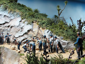 Diorama of 19th-century soldiers fixing a landslide on a track.