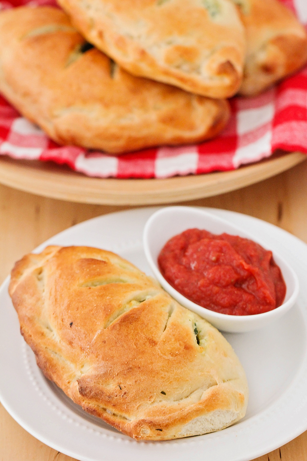 These cheesy and savory spinach ricotta calzones are so delicious and the perfect meatless meal! 