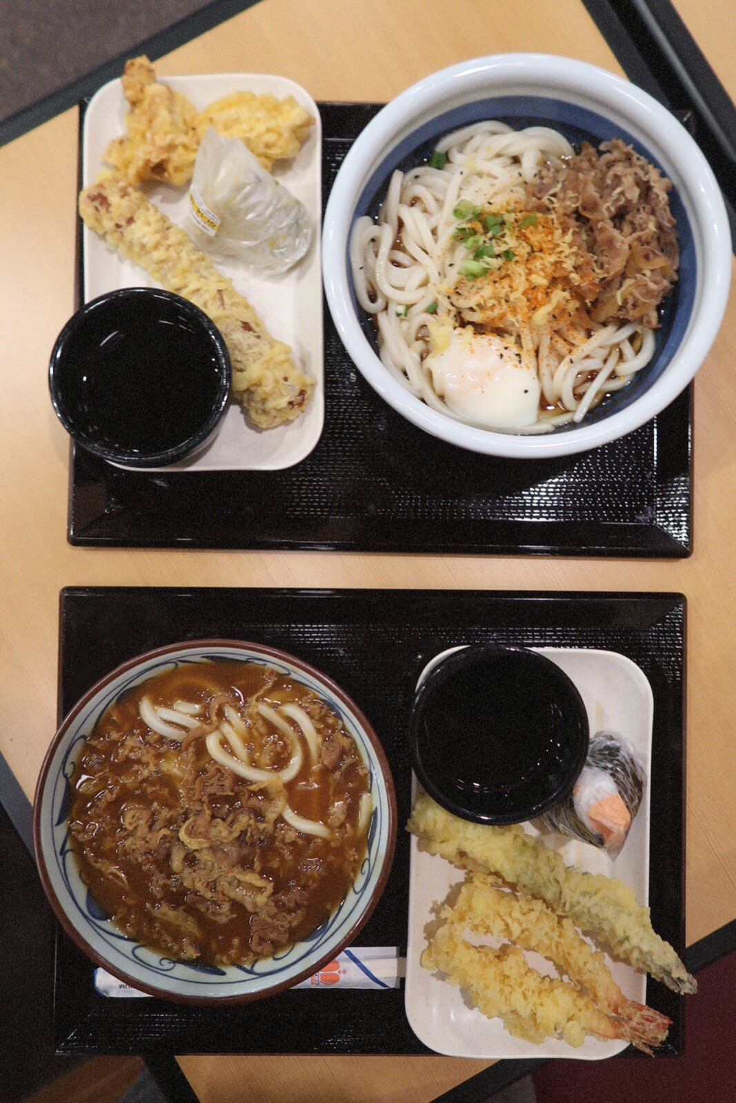 Noodz #onthetable #onthetable: Marugame Udon Curry Noodle Udon bowl, Nikutama Udon noodle bowl, shrimp tempura, and musubi.
