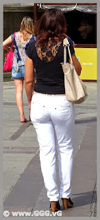 Slender lady in white jeans on the street