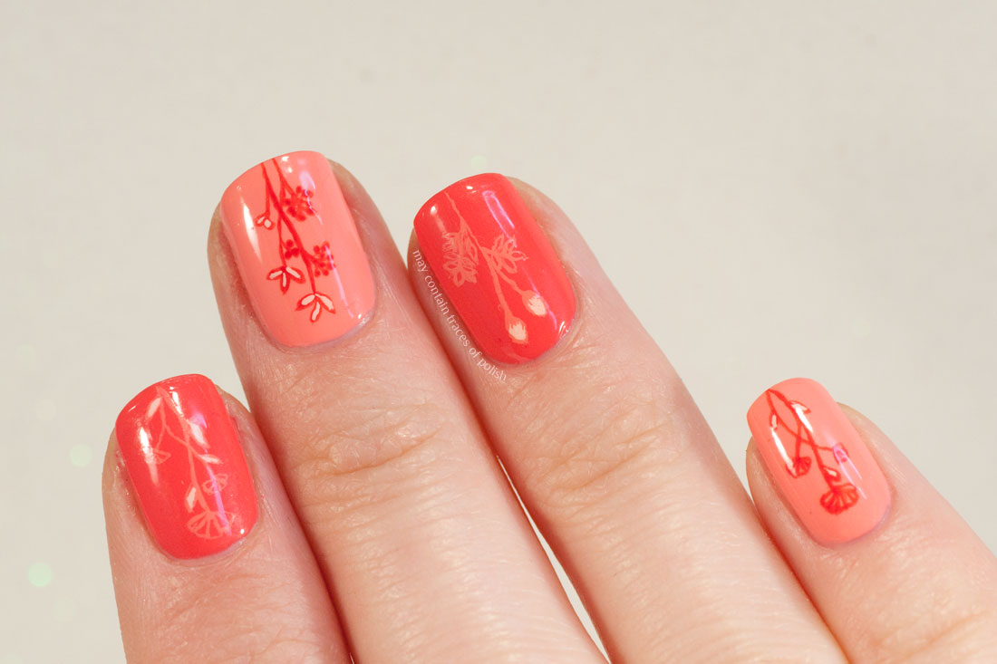Minimalist Floral Nail Art in coral pink tones