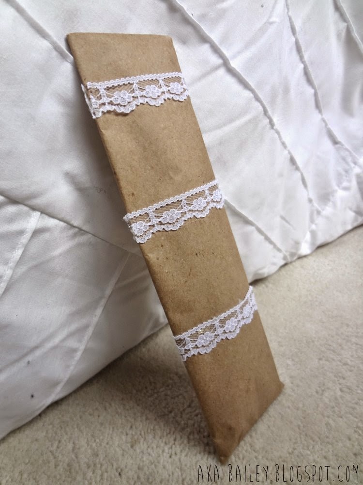 Brown paper gift wrap wrapped with lace trim