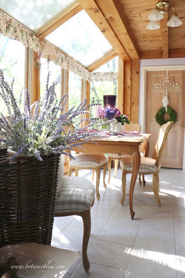 French lavender in a French market basket in a French-inspired garden and home with posts and beams