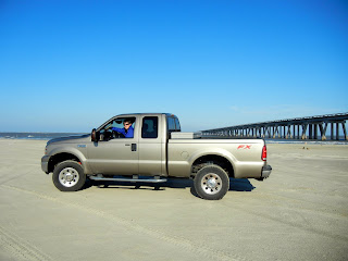 Our truck, on the beach in Galveston, TX