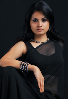 Spicy Madhulika navel show in black saree