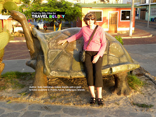 Travel Boldly Galapagos Island - During a walk to dinner at La Playa, in Puerto Ayora, Sally makes friends with a giant tortoise sculpture.