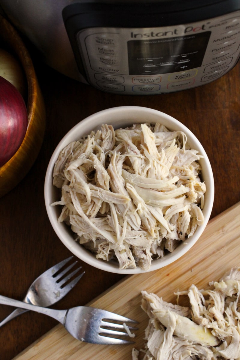 This 8 Quart Instant Pot Shredded Chicken recipe makes perfectly cooked, juicy, versatile shredded chicken breasts that can be used in tons of recipes! #instantpot #chickenrecipe #mealprep