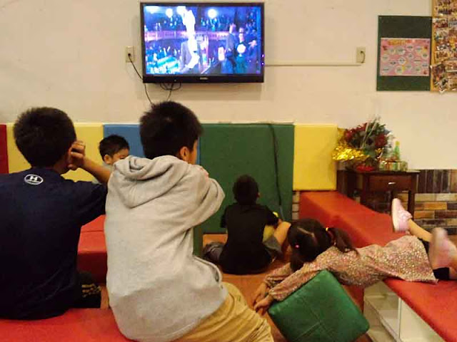 children,wide screen TV, movie, playing