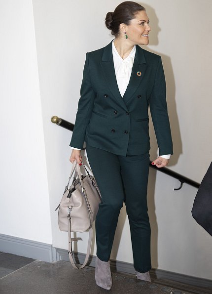 Crown Princess Victoria wore Tiger of Sweden Molena suit. Af Klingberg rakel taupe suede boots. Caroline Svedbom green earrings