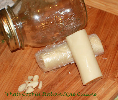 Homemade Italian Almond Paste Recipe this is a delicious homemade almond paste using freshly ground almond for cookies, pastries and all Italian style recipes using almond paste. It is stored in a mason jar.