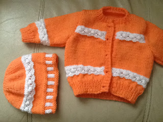 http://www.craftsy.com/pattern/knitting/clothing/peach-baby-cardigan/148934