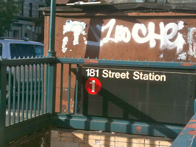 A station entrance to the IRT Broadway line in New York City is accessible by a staircase.