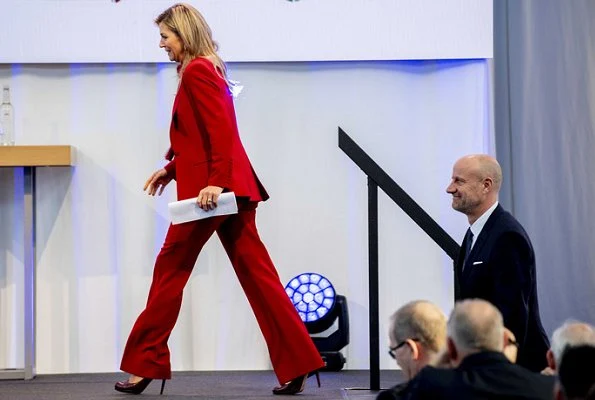 Queen Maxima wore a red blazer and trousers by Claes Iversen, and red blouse by Claes Iversen, with her L.K. Bennett pumps. at trade conference