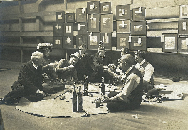 Society of Artists' Selection Committee, Sydney, 1907 / photographer Henry King. (l to r) Julian Ashton, Mrs Norman Lindsay, Harry Weston, Will Dyson, Norman Lindsay, young Souter, Sidney Long & D.H. Souter. Norman Lindsay is perhaps the best known of these young bohemian artists having a picnic in their rooms. He is looking pensive, fifth from the left.