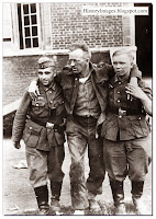 Two German soldiers support  wounded Canadian soldier after Dieppe raid. August 1942.Rare WW2 Images