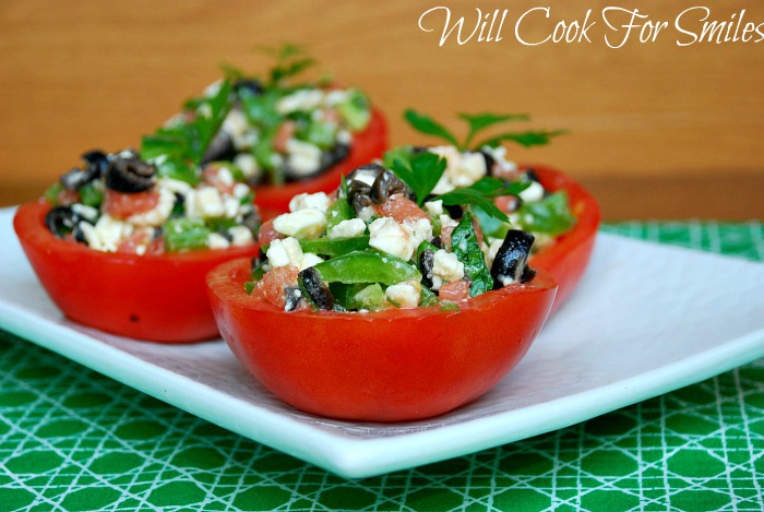 four Mediterranean Stuffed Tomato Cups on a white plate