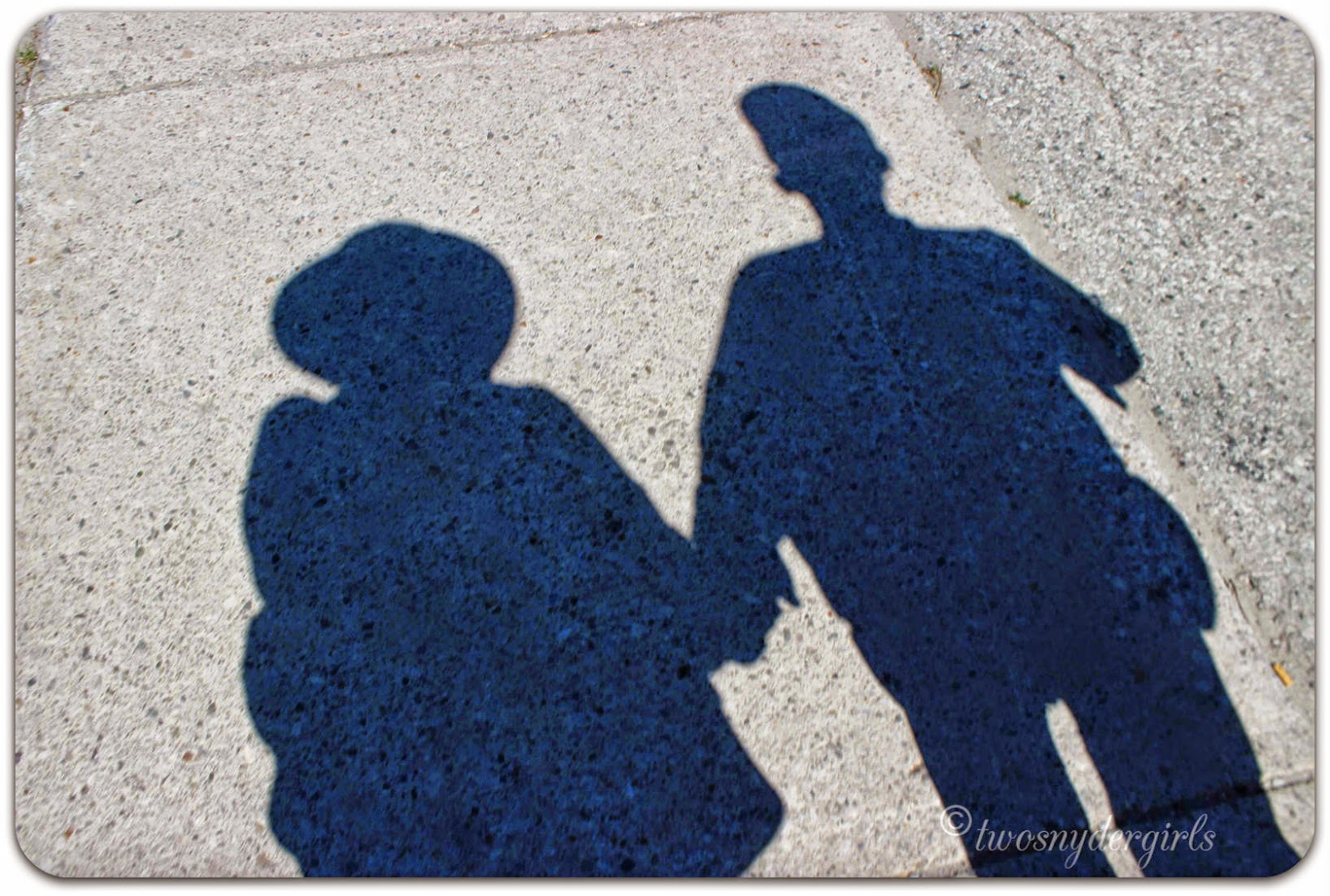 The shadow of a couple walking The shadow of a couple walking