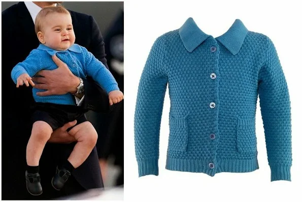 Prince George was wearing Moss Stitch Cardigan and Navy Blue Shorts both SS14 by Rachel Riley.