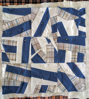 Improv pillow top of nine six-inch blocks made of three vintage men's shirts.