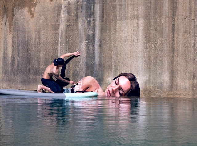 Get ready boys and girls... Here we go with a stunning and unbelievably creative new way of painting murals. Meet Sean Yoro, a NYC-based artist which decided to grab his surfboard, a bunch of acrylic paints, and get as far away from the street as possible!!