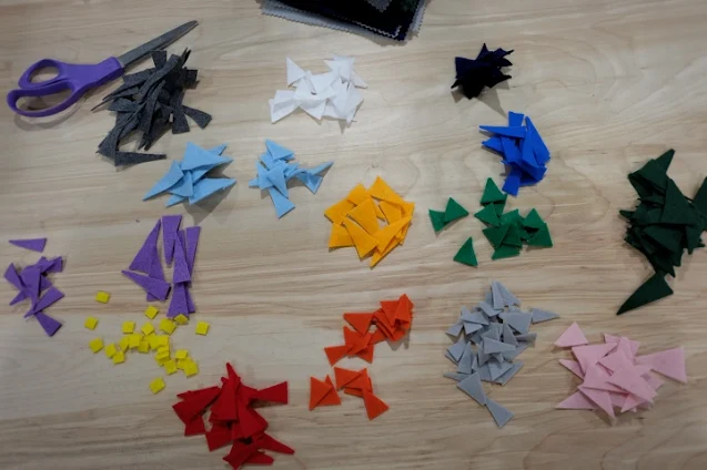 pile of different colored felt triangles