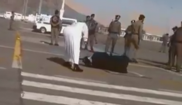 A Burmese woman is beheaded in public in Saudi Arabia in January 2015.