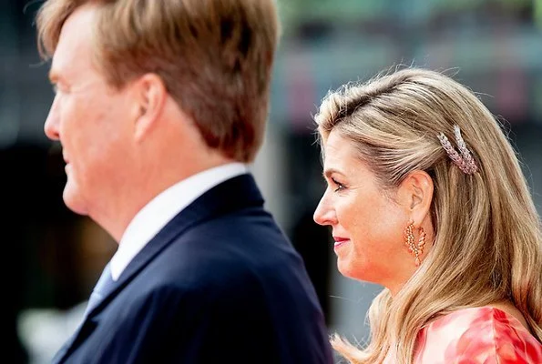 Queen Maxima's outfit is from the fashion house Natan floral print dress. President Michael Higgins and Sabina Higgins