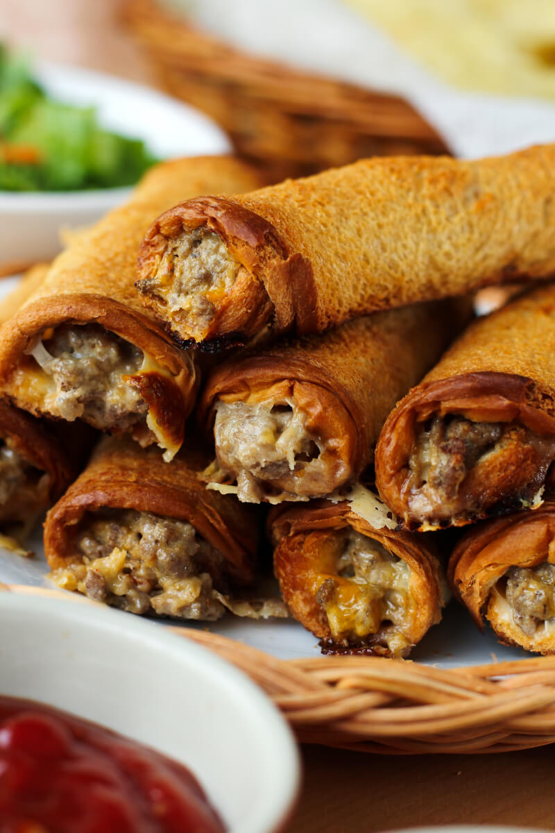Cheeseburger Roll-Ups put a fun spin on burger night. They will make the whole family happy with their crisp, buttery outside and delicious cheeseburger filling! #groundbeefrecipes #easydinner