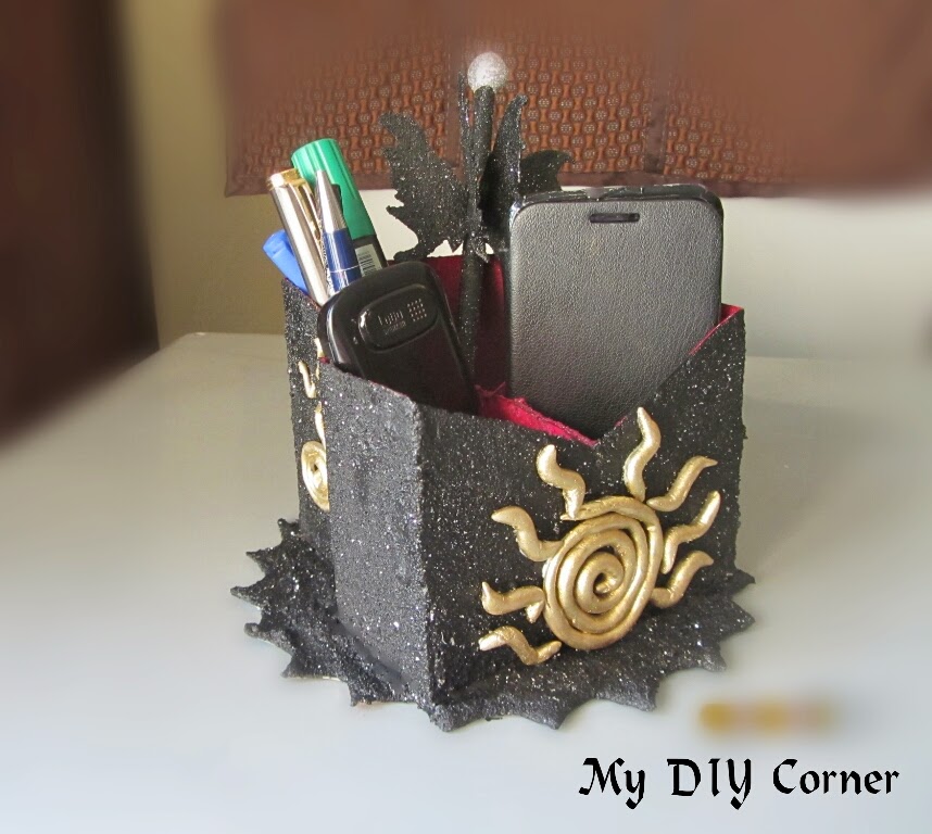 http://www.mydiycorner.in/upcycled-phone-stand/