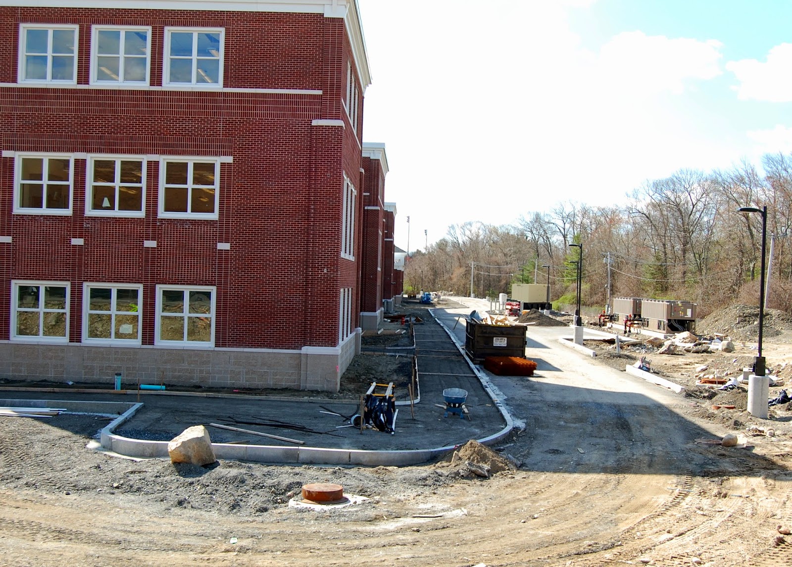 new FHS - sidewalks and landscaping in rear