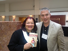 Dr. Alveda King receives a copy of Chloe's Book "Making a Case for Life" at an International Forum