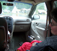 You may notice the teepee through the windshield of the photo, Patti already in her water proof wheelchair lap blanket, a reflection of me taking the picture in the rear view mirror and the sheer boredom captured on Patti’s face.