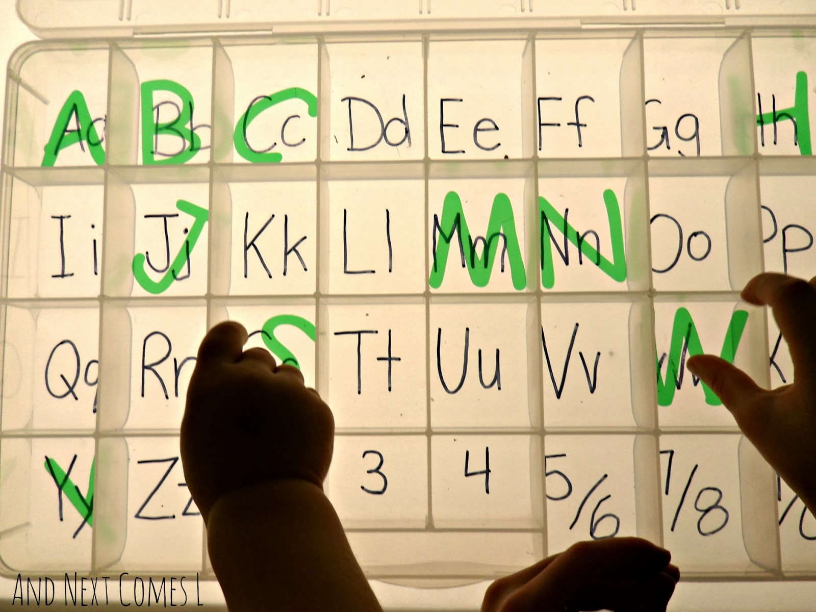 Alphabet sorting on the light table from And Next Comes L
