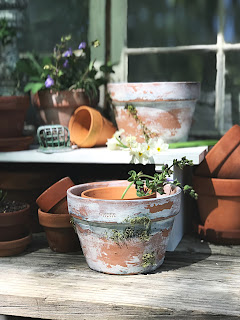 EASY DIY to Age New Clay Pots.  Step by Step instructions to aging your pots. Farmhouse-style potting bench.