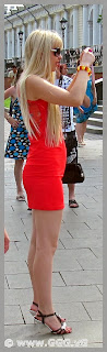 Girl on the street wearing red summer dress