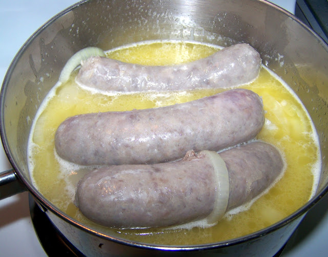 Brats Cooked in Butter, Beer and Onions