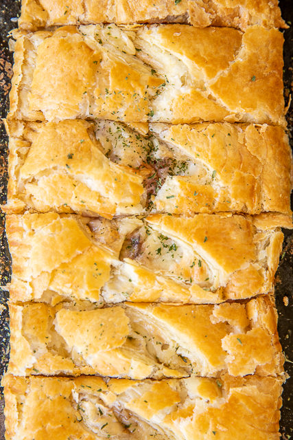 Ham & Cheese Slab Pie - delicious hot ham and cheese puff pastry sandwiches. Only a few simple ingredients - ham, swiss cheese, cream cheese, honey mustard and puff pastry. Brush pies with an egg wash to get a nice golden color. We love these for breakfast, brunch, lunch and dinner. Can make in advance and freeze unbaked for later! A great alternative to plain ham and cheese sandwiches! #puffpastry #ham #cheese #freezermeal #sandwich #bakedsandwich #slabpie Ham & Cheese Slab Pie - delicious hot ham and cheese puff pastry sandwiches. Only a few simple ingredients - ham, swiss cheese, cream cheese, honey mustard and puff pastry. Brush pies with an egg wash to get a nice golden color. We love these for breakfast, brunch, lunch and dinner. Can make in advance and freeze unbaked for later! A great alternative to plain ham and cheese sandwiches! #puffpastry #ham #cheese #freezermeal #sandwich #bakedsandwich #slabpie