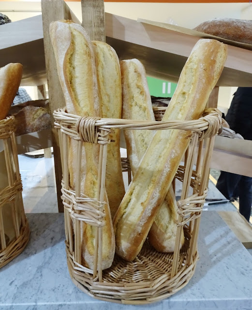 LIV Organic and Natural Food Market Freshly baked baguettes in a wicker basket