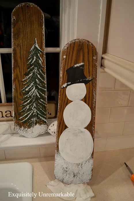 rustic Christmas tree and painted snowman signs
