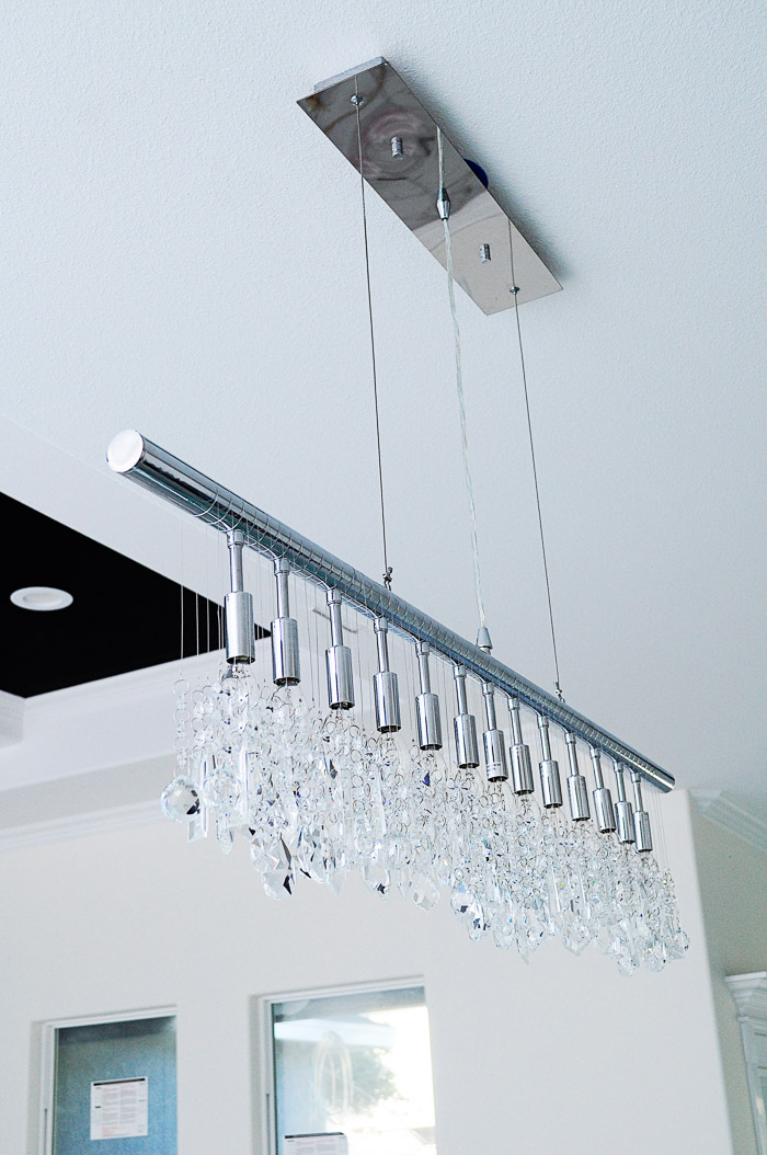 13-Light Linear Crystal Chandellier Review: Our lighting choices for our new home. Learn how we saved $1000. | via monicawantsit.com