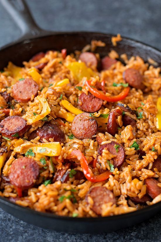 Smoky kielbasa sizzled with sweet bell pepper, onions and garlic in vibrant tomato sauce. This quick and easy sausage, pepper and rice skillet is downright delicious!