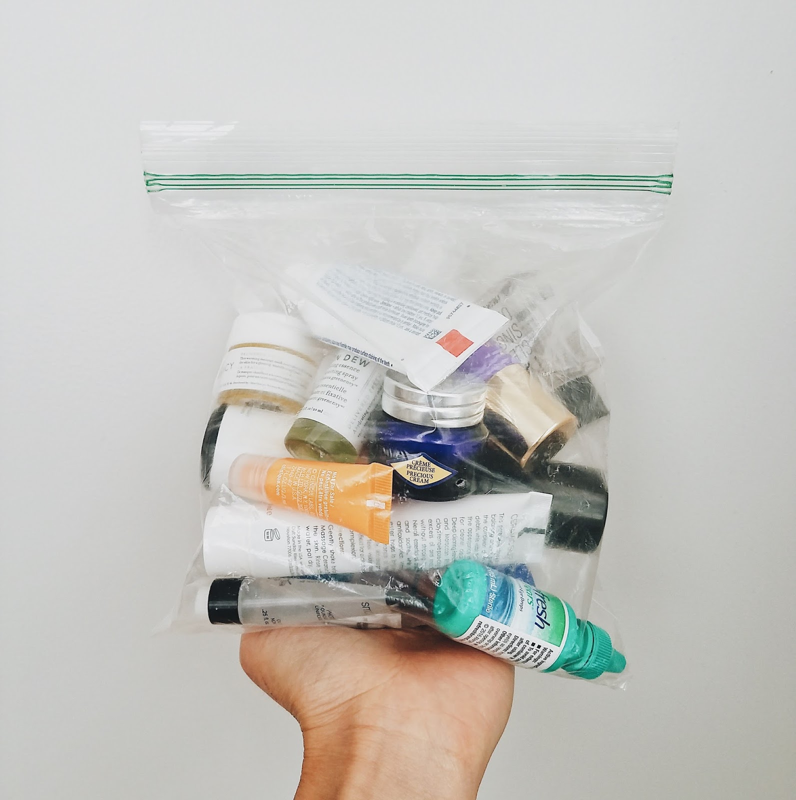 Evidence of The Jen Project's travel skincare products fitting into a quart-sized TSA-approved Ziploc.