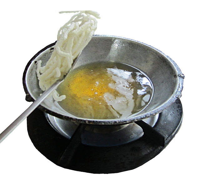 food being fried in hot oil