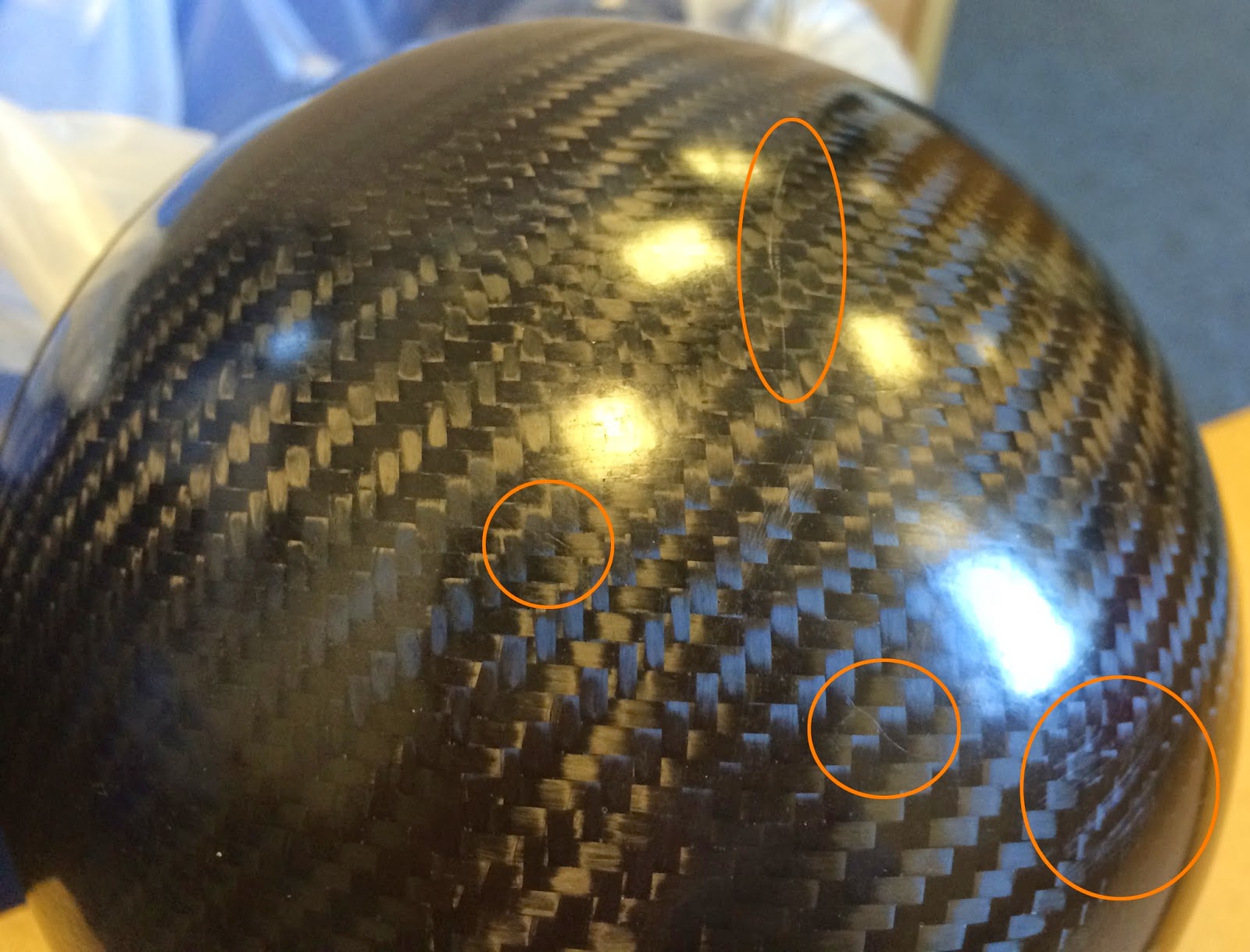 Caterham Carbon Headlight Bowls - with some of the scratches highlighted.